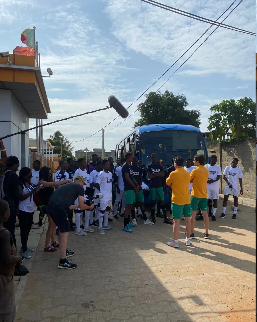 Football Dreamz squad arriving by team bus as the crew films