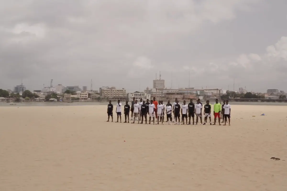Squad lined up on the beach for a training session